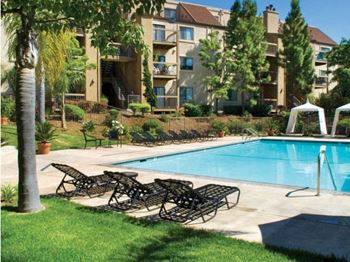 Lounge Chairs by Pool at BELLA VISTA AT HILLTOP, Richmond